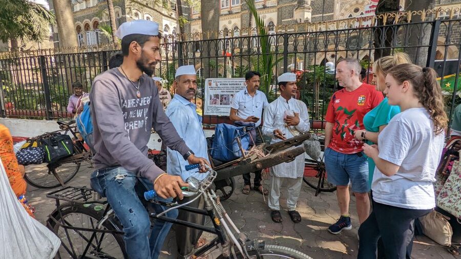 Mumbai: Dharavi Slum, DhobiGhat, and Dabbawallas Tour - Starting near Churchgate and riding the local train