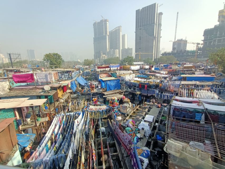 Mumbai: Dhobi Ghat Tour with Dharavi and Train Ride Options - Why Mahalaxmi Dhobi Ghat is worth seeing